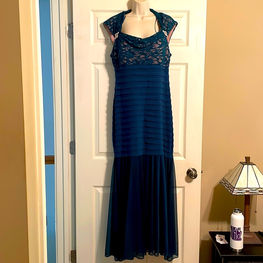 Formal full length gown. Fully lined. Soft pretty flattering fitted then flares